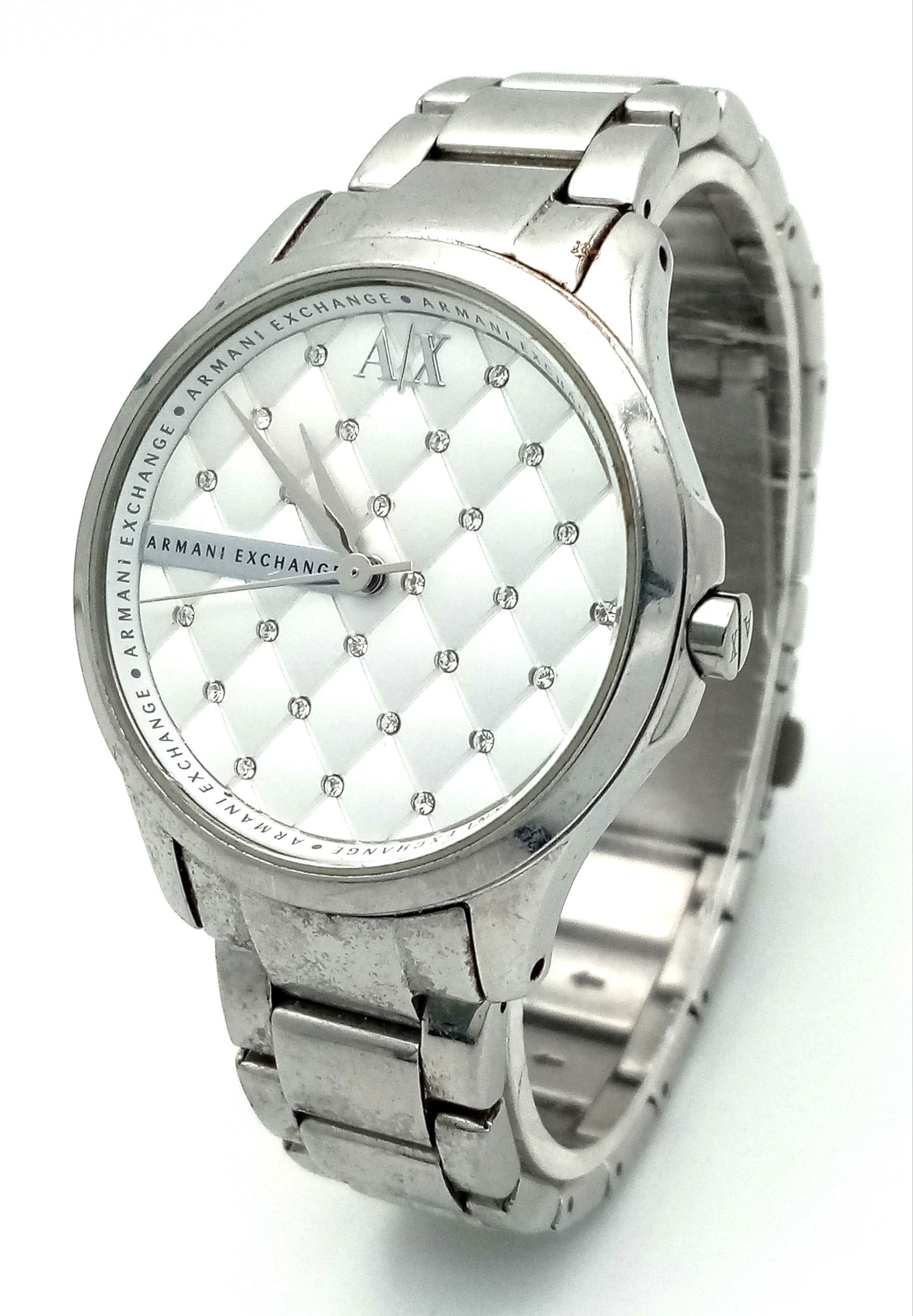 A Stylish Armani Exchange Gents Watch. Stainless steel bracelet and case - 37mm. White padded effect: A Stylish Armani Exchange Gents Watch. Stainless steel bracelet and case - 37mm. White padded effect dial with white stone decoration. New battery recently fitted - In working order.