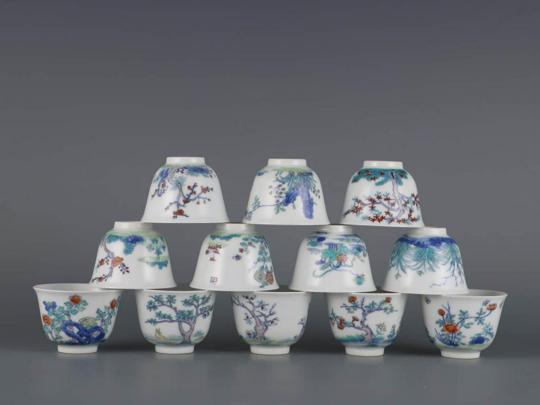 SET OF TWELVE DOUCAI GLAZE IMMORTALS FLORAL CUPS (1 of 9)