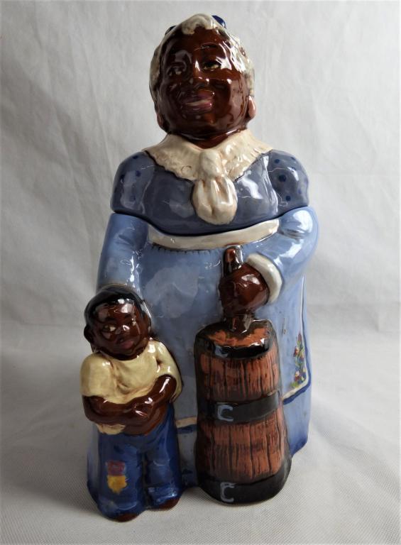Rick Wisecarver Black Mammy Cookie Jar Signed: Rick Wisecarver (1950-2002, American) Wihoa's Original Black Mammy Cookie Classie Jar. Signed at Bottom. Measures 14" tall. Condition: Good