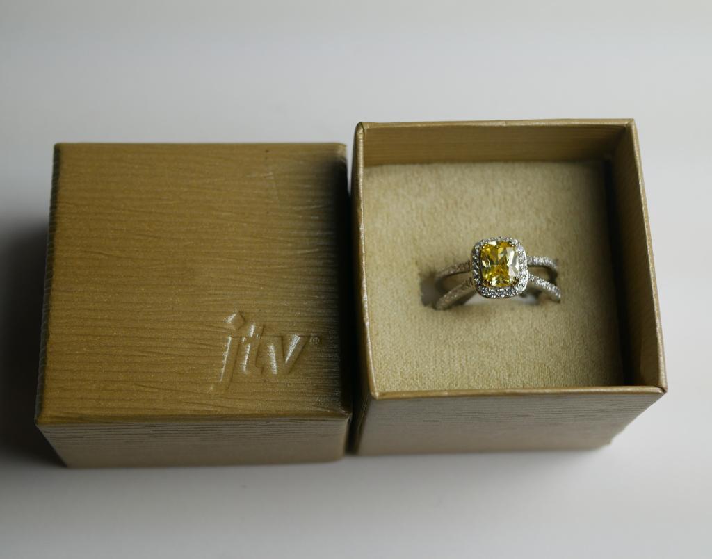 Sterling Silver Blue Luce Canary Ring: Rhodium over Sterling Silver Ring with Blue Luce Canary and White Diamond Simulants. Condition: New