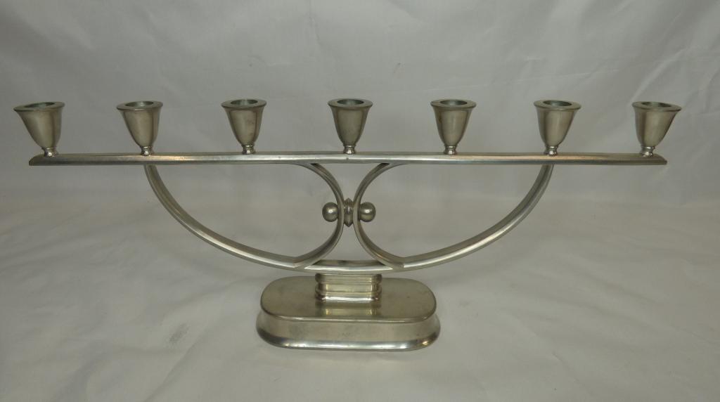 Vintage Large Metal Judaica Menorah Candleholder: Vintage Large Silvertone Metal Menorah Candleholder marked on bottom "JUST" 1534. Measures 21" x 8 1/2". Condition: Good