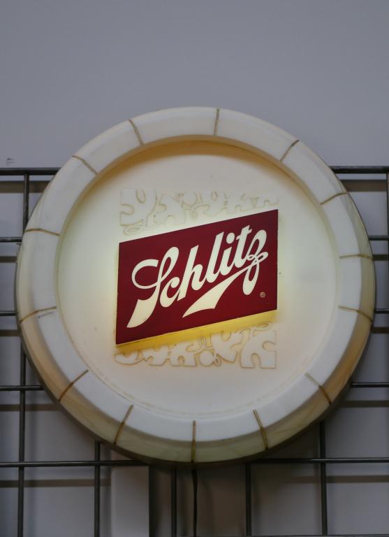 1960's Schlitz Round Lighted Beer Advertising Sign: 1960's Schlitz Round Lighted Beer Advertising Sign. Measures 13" in diameter. Good Working Condition