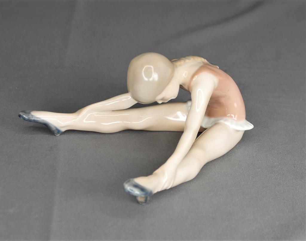 Royal Copenhagen Stretching Ballerina 5269 Figurin: Royal Copenhagen Stretching Ballerina 5269 Porcelain Figurine. Measures 2 3/4" x 6" x 5". Condition: Good