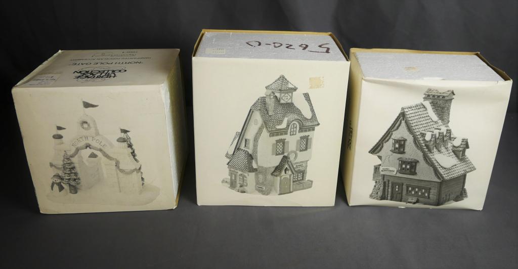 Department 56 North Pole Village - Houses & Gate: Heritage Village Collection. North Pole Series. Lot of 3. "North Pole Gate", "Neenee's Dolls and Toys" and "Elf Bunkhouse". Condition: Good, all with original boxes