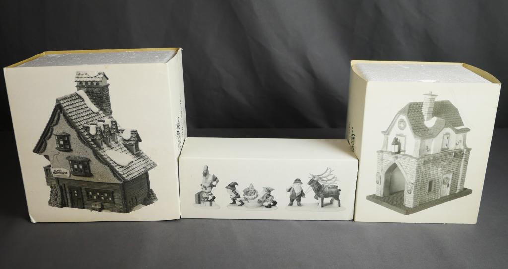 Department 56 Christmas Village- Lot of 3: Heritage Collection- "Elf Bunkhouse", "Santa's Little Helpers" and "Gate House". Condition: Good, all in original boxes