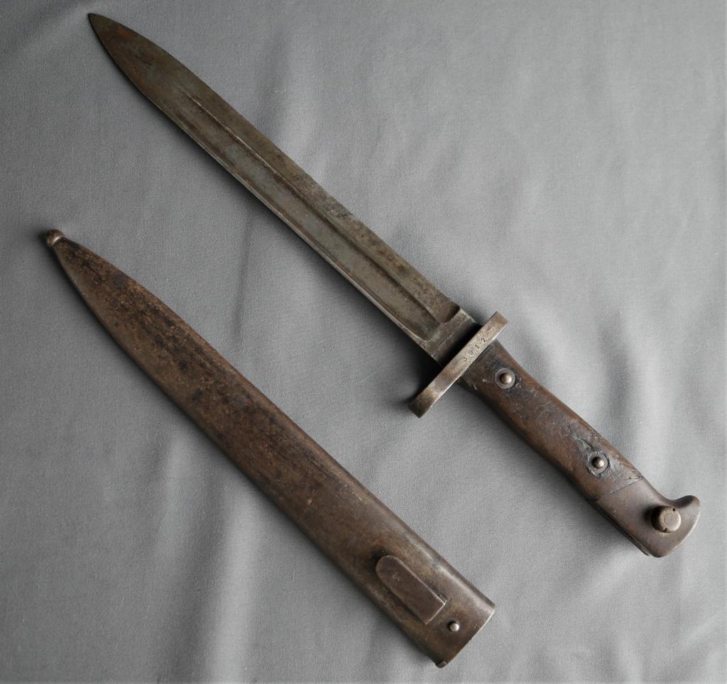WWI Austrian Mauser Combat Bayonet: WWI Period Austrian model 1886 Bayonet for Mauser Rifle. Serial Number 3917 on guard and "CE WG" Mark on Blade. Condition: Good overall condition, normal age related wear