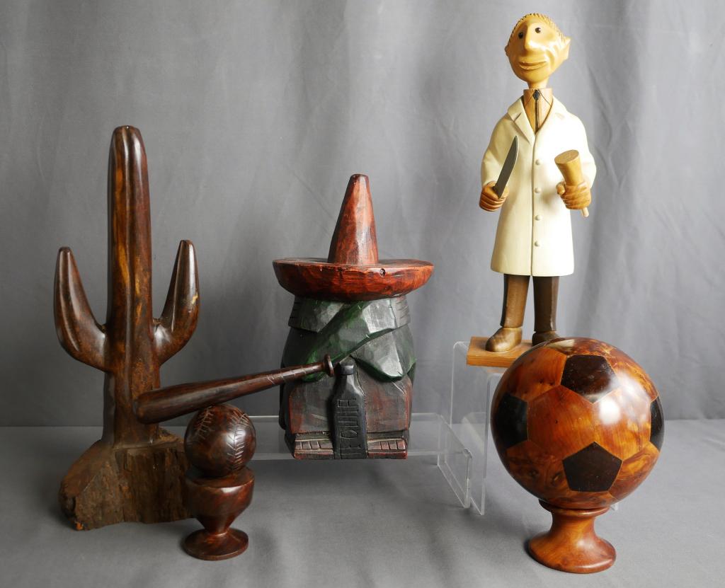 Wooden Carved Figurines- Baseball, Soccer Ball: Group of Wood Carved Figurines including. Baseball Ball with Bat; Soccer Ball on Stand, Italian Made Doctor Figurine, Cactus and Mexican Guy with Tequila Bottle. Tallest piece is 13" high. Condition: 