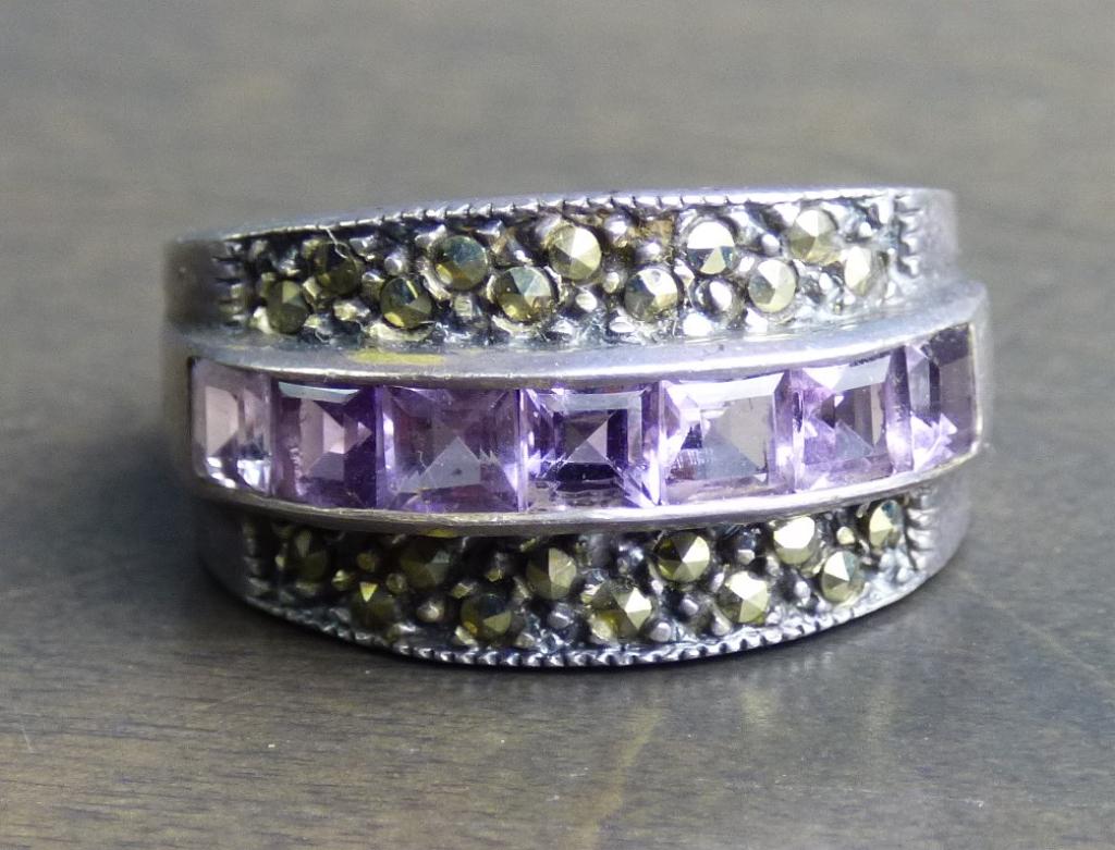 Sterling Silver and Amythest Ring: Marcasite Sterling and Amythest ring. Size 8.5. Condition is good.