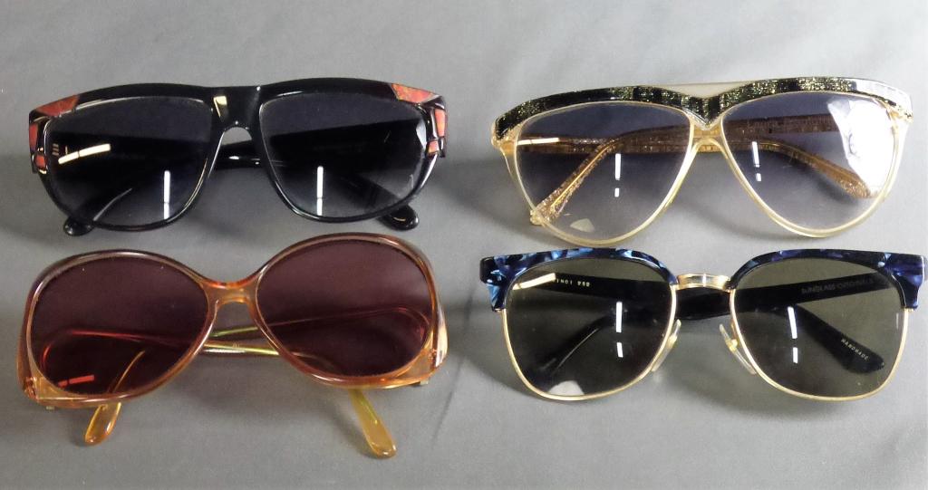 Lot of Four Retro Designer Sunglasses: Yves St Laurent - "Marakesh" 8857/2, made in France; Laura Biagiotti style "OSXOL" made in Italy; Davinci "252"; Bill Blass. Condition good with minor signs of wear.