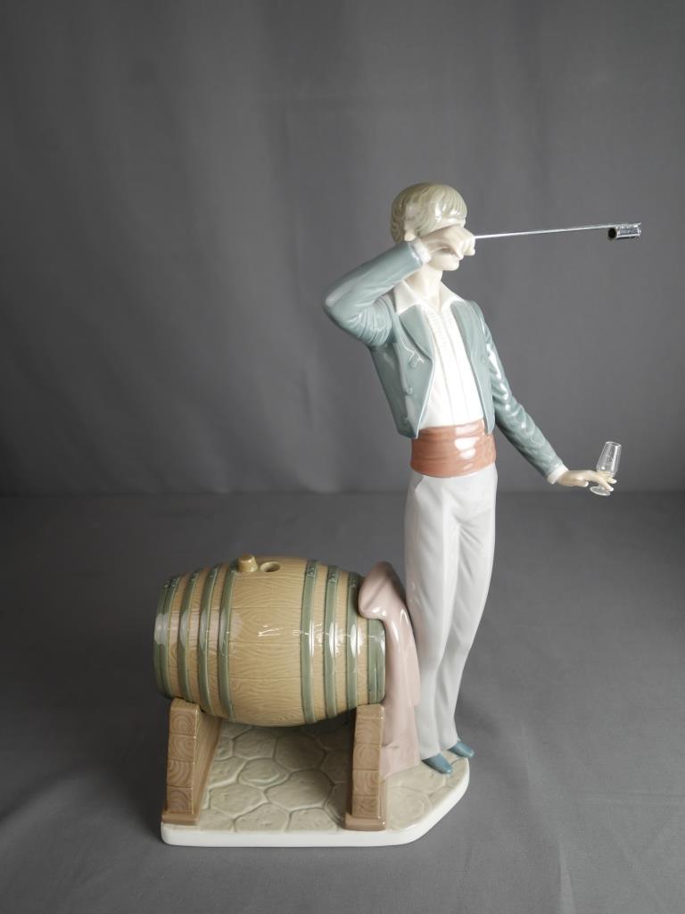 Lladro Wine Taster 5239 Porcelain Figurine: Lladro "Wine Tester" Porcelain Figurine by sculptor Francisco Catala. 5239. Measures 14 1/2" tall. Condition: Good, comes with the box (no inner packaging)
