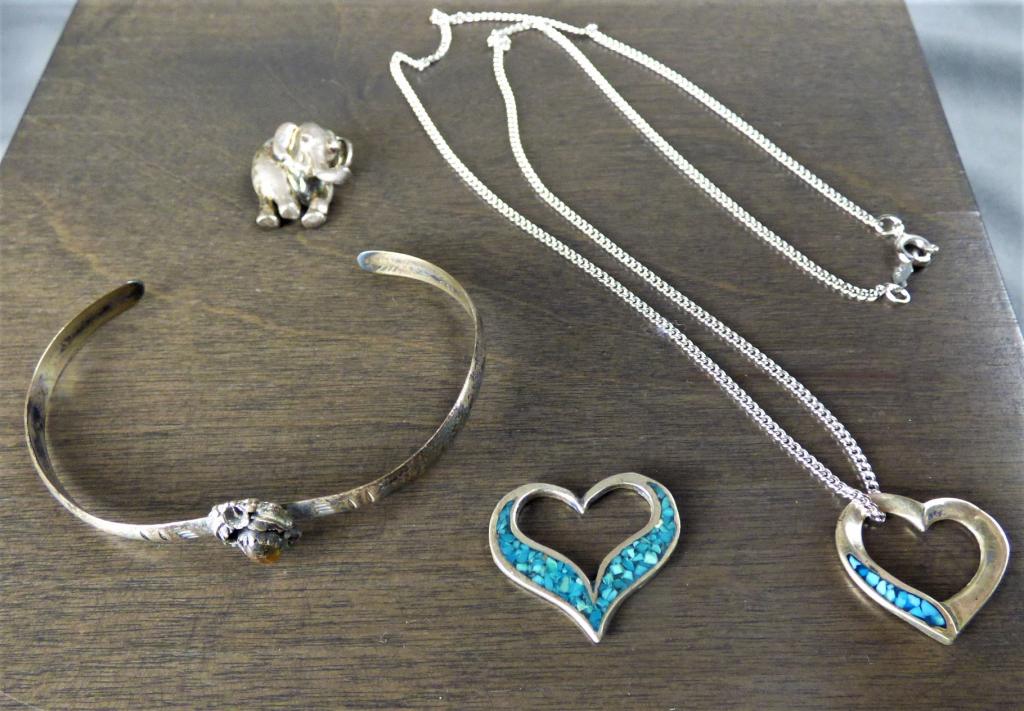 Sterling Silver Jewelry Lot- Bracelet, Pendants: A fun eclectic lot of multiple pieces of sterling jewelry. Includes two gorgeous turquoise and sterling heart pendants (one on sterling chain), simply adorable sterling elephant pendant, and one Arts
