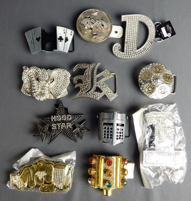 Bling Belt Buckle Lot - Street, Music Hip Hop, Gan: Lot of large belt buckles with rhinestones and shiny metal. Includes traffic light belt buckle, spinning ladies, skullcap knight, Zippo holder belt buckle with aces, Olde English letters, elephant, et
