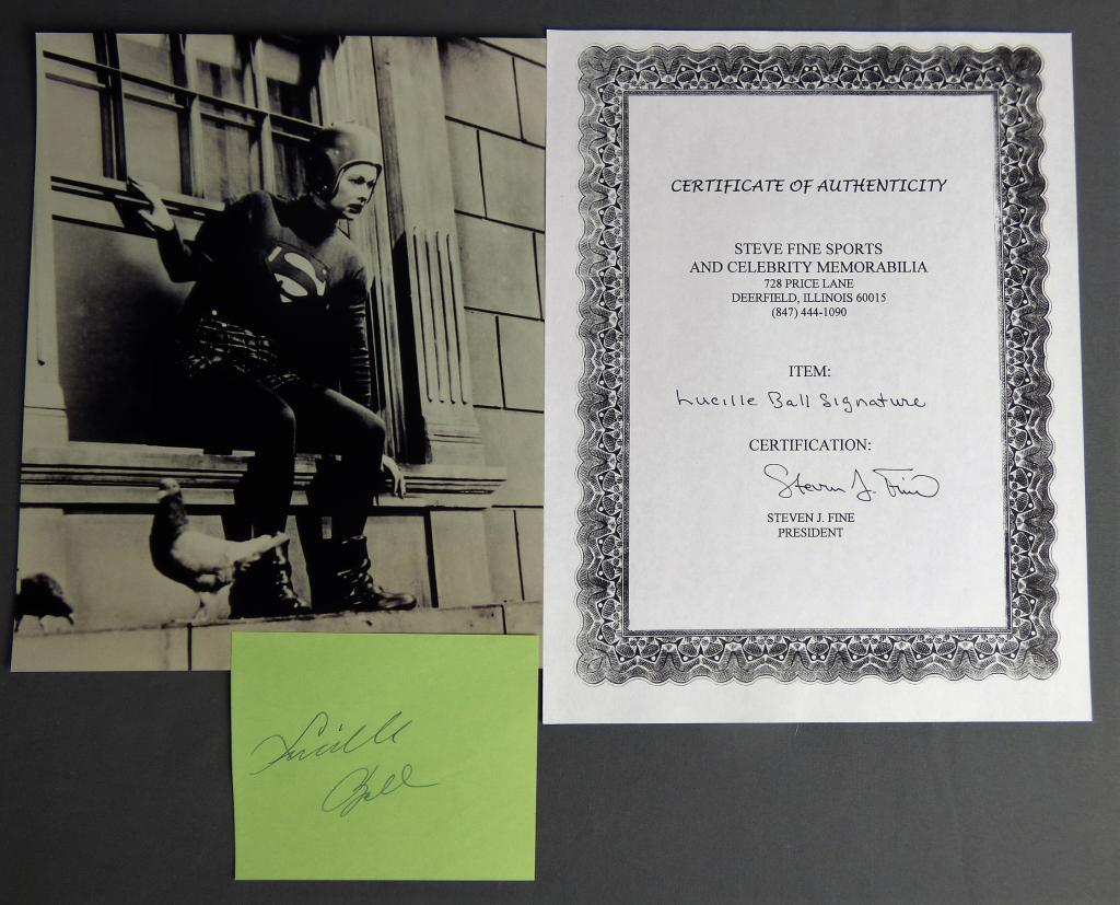 Lucille Ball Signature w/ COA & Superwoman Photo: Lucille Ball Signature on Card with Certificate of Authenticity and Superwoman B/W Photograph. Condition: Good We truly believe that this item is authentic, but Esquis Auctions does not have specialis