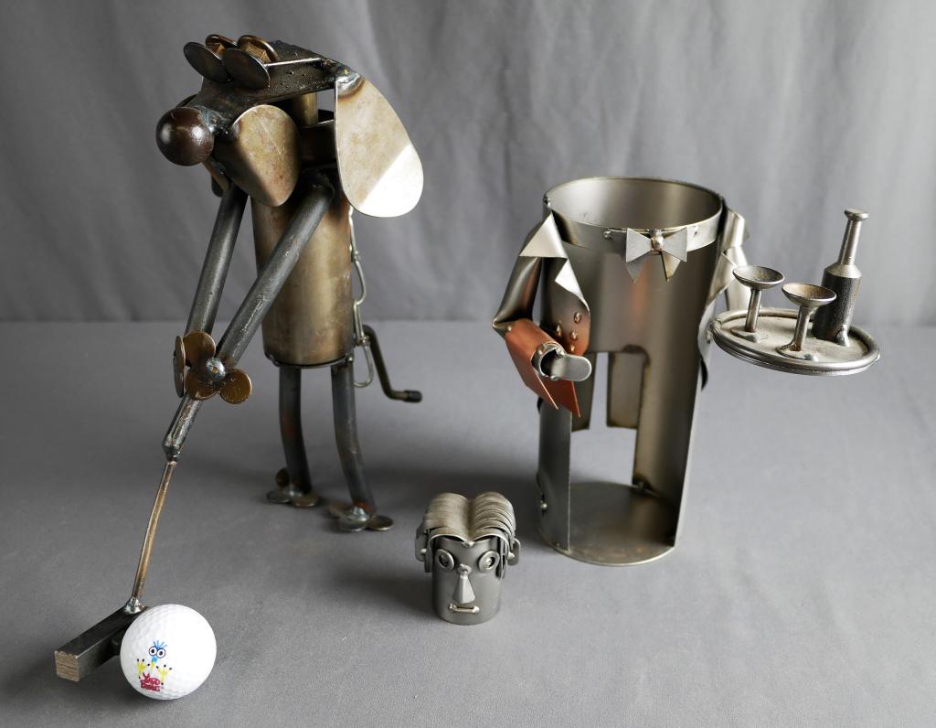 Metal Waiter Wine Bottle Holder & Yardbirds Golfer: Metal and Copper "Waiter" wine bottle holder by H&K Steel Sculptures. Measures 8" x 6.75". In great condition. This lot also includes a metal golfing dog sculpture by Yardbirds, measuring 11" high by