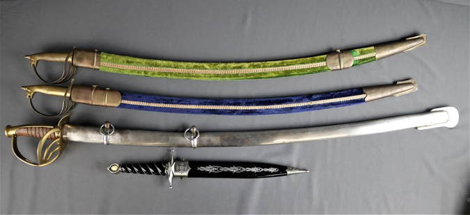 Group of Vintage Daggers & Swords: Lot of four vintage souviner swords and daggers. Two Swords with brass handles in blue and green velvet cases, as well as a large brass and wood handled sword in a steel case and stainless steel Dagge