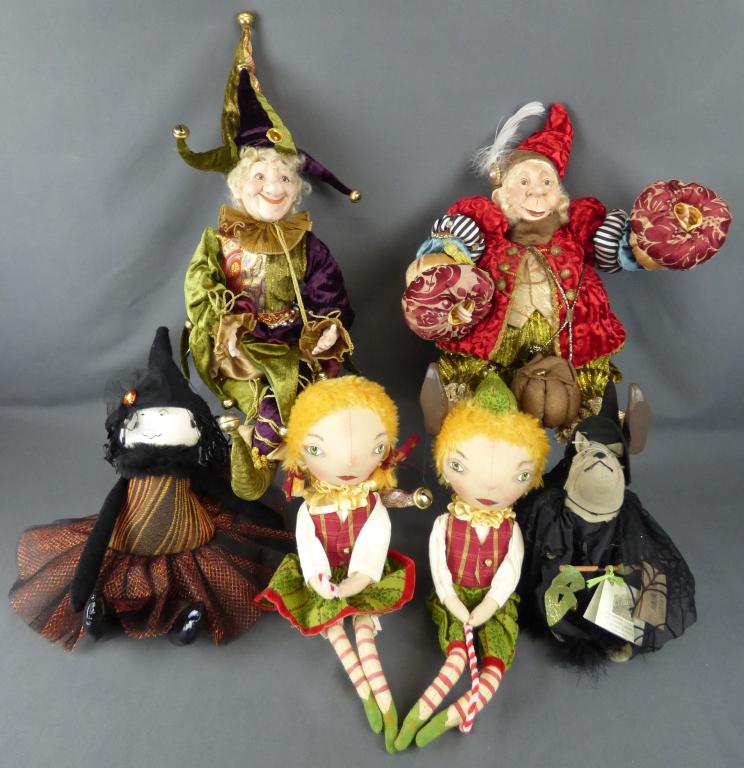 Lot of Whimsical Plush Jesters and Dolls: Lot of six whimsical plush dolls. Includes two elves, a "Gathered Traditions" witchy Halloween rat, a "Woof and Pouff" witch, and two Jesters, the larger one with red velvet is by the "Lam Lee Group."
