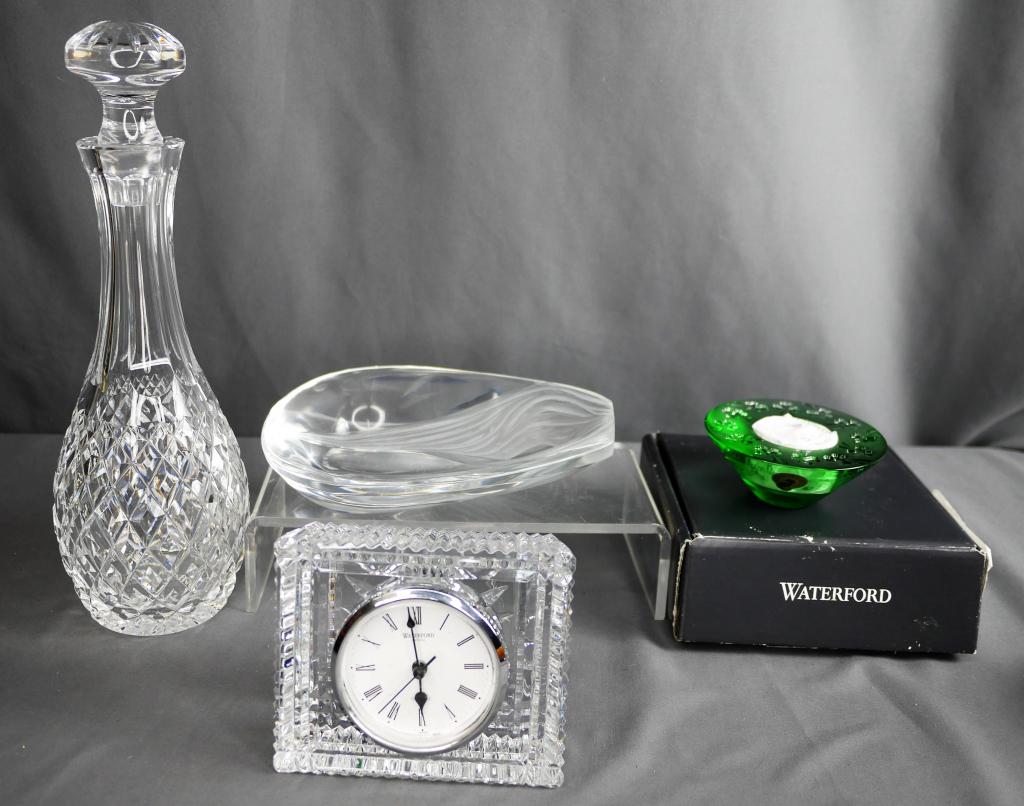 Lalique and Waterford Art Crystal Lot: Lalique Ashtray, Waterford Clock, Waterford Decanter; Waterford green Candleholder. Condition: Good, Laliqe has small chip to the base