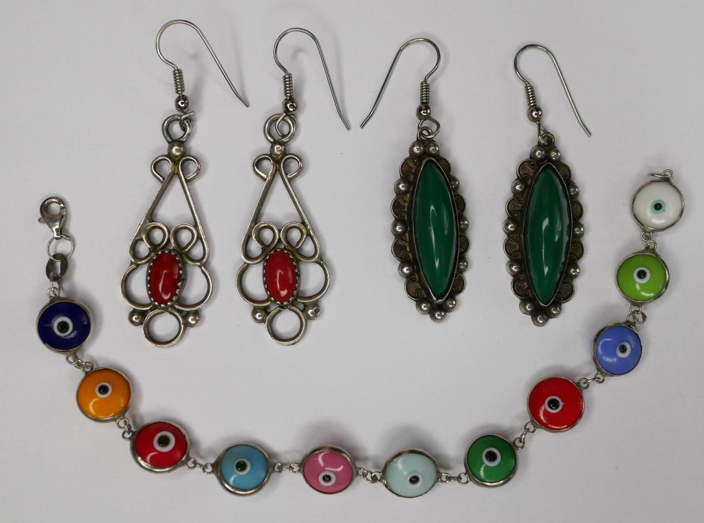 Sterling Silver Bracelet and Earring Lot: Lot of two drop pendant earrings, one with what looks to be malachite or green turqouise and sterling as well as the other with coral and sterling. Bracelet features dual sided evil eye details and me