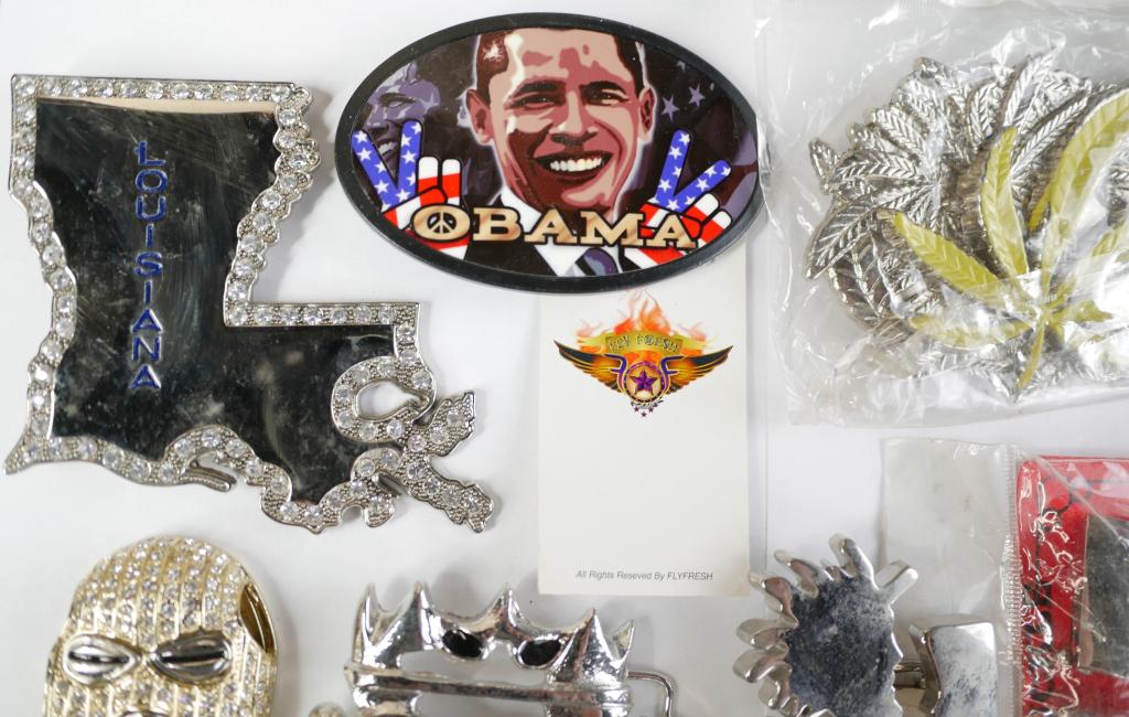 Bling Bling Lot of Belt Buckles: Bling bling lot number two of belt buckles. Includes 12 belt buckles of various styles and bling including cannabis leaf, Obama, DC, Running Man and more. All are in good condition, like new.