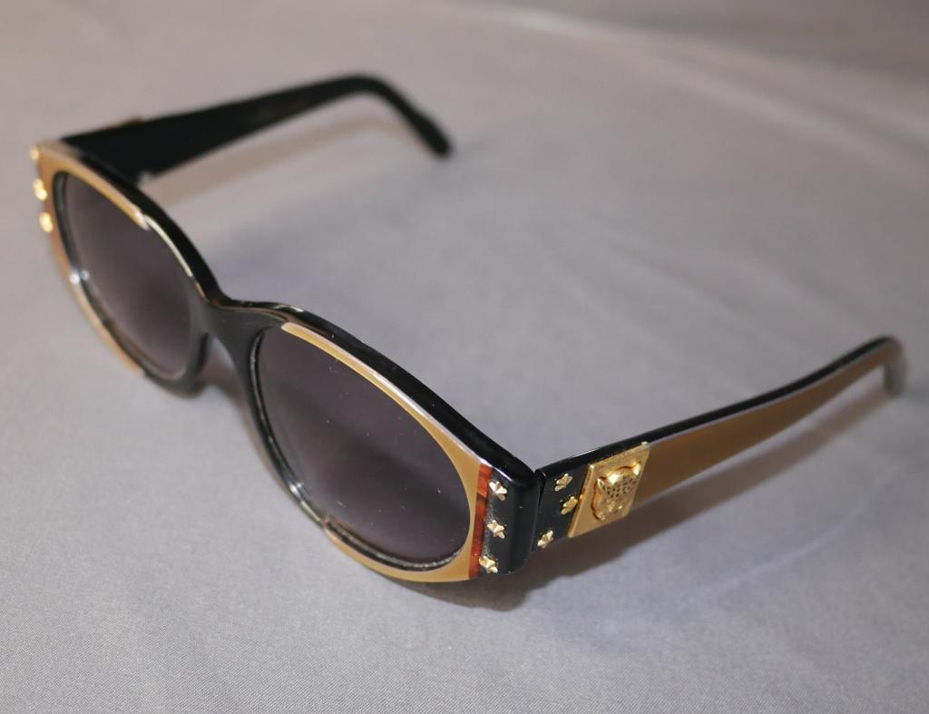 French Handmade Star Sunglasses w/ Leopard Head: Sunglasses handmade in France. Star details adorn the sides and leopards with rhinestone eyes are on each side as well. Lovely gold details and black lenses. Handmade in France! In great condition.