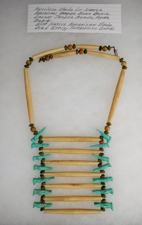 Hairpipe Bone, Jasper, Agate & Turquoise Necklace: Native American forged hairpipe bone, desert jasper, and agate beaded necklace. Unique ladder design. Features Native American made turquoise bird Effigy beads. Measures 15" long on each side; by arti
