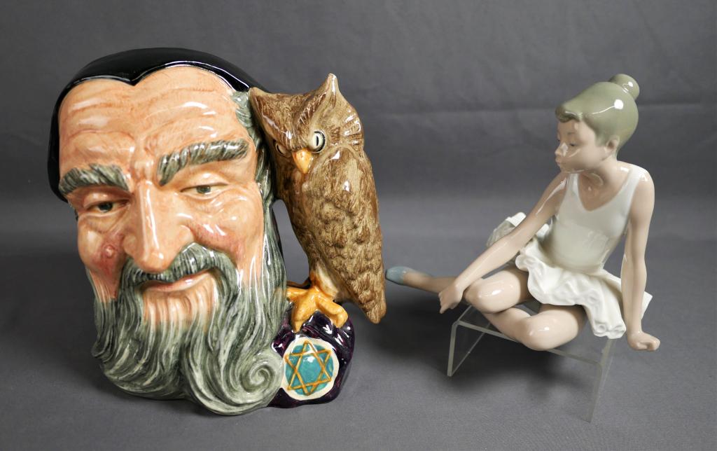 Nao by Lladro Ballerina & RoyalDoulton Merlin Toby: Nao by Lladro "Sitting Ballerina" Porcelain Figurine and Royal Doulton D6529 "Merlin" Large Toby Jug. Measure 7 1/2" and 4 1/2" tall. Condition: Good