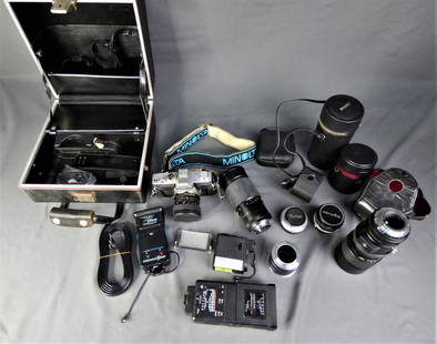 Minolta SRT 100 Film Camera w/ Large Lot of Lenses: Vintage Minolta SRT 100 35mm Lens Camera with Super Albinar Auto 1:2.8 f-28mm Lens. Comes with Large carrying case full of extra lenses and accessories. Lenses included in lot are Vivitar f- 