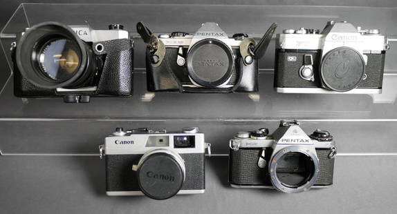 Lot of Vintage 35mm Film Cameras- Canon, Yashica: Groupof Vintage 35mm Film Cameras. Includes: Yashica TL-E with Yashica 1:1.7 f-50mm lens; Canon FT Ql (body only); Canon with 40mm 2.8 Lens; Pentax ME (body only) and Pentax ME Super (Body only).