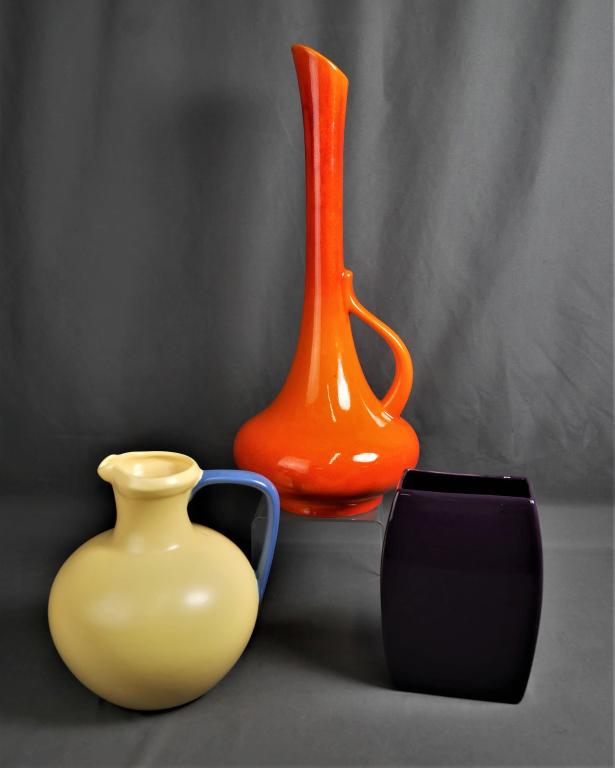 Vintage Royal Haeger & Haeger Pottery Pitchers Vas: 3 pieces of Vintage Pottery. Royal Haeger #408 Screaming Orange 19" tall Vessel/ Pitcher; 1997 Haeger Yellow 8" tall Pitcher and 2004 Haeger 622-48 6" Purple Vase. Condition: Good