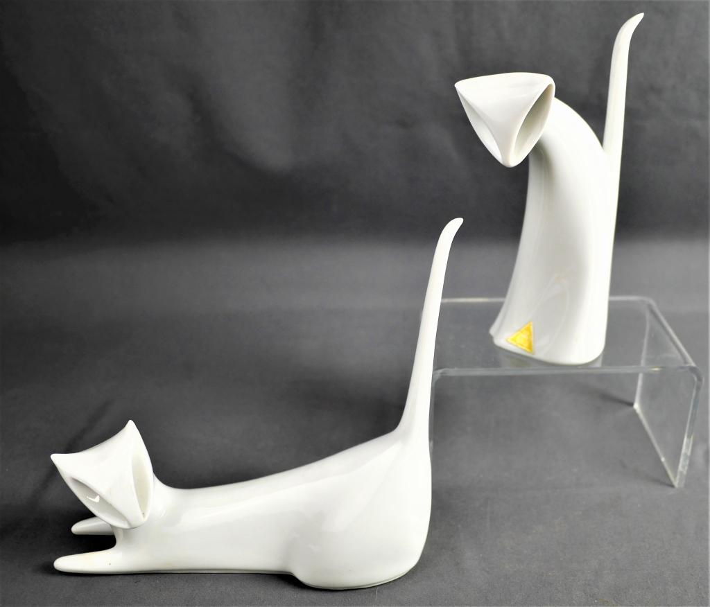 Two MCM Royal Dux White Porcelain Cats Chechoslova: Two Mid Century Royal Dux White Porcelain Cats, Made in Chechoslova. Measure approx. 4" tall. Good Condition.