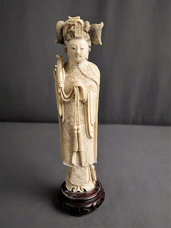 Antique Oriental Chinese Carved Bone Figurine: Antique \ carved ivor. bone Figurine. Gorgeous detail and intricate carvings on every centimeter of this piece depicting a woman holding a scroll. Stands on mahogany base. Measures 9 1/2" tall. Incred