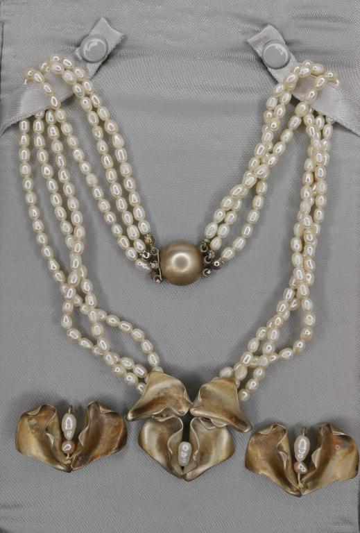 Holly Stults Designer Sterling & Pearls Necklace &: Holly Stults Designer Sterling Silver & Pearls Necklace and Earrings. Large Sterling Orchid Enhancer with Large Baroque Pearl on Pearl Multi Strand Necklace. Pair of matching earrings. Necklace is 17"