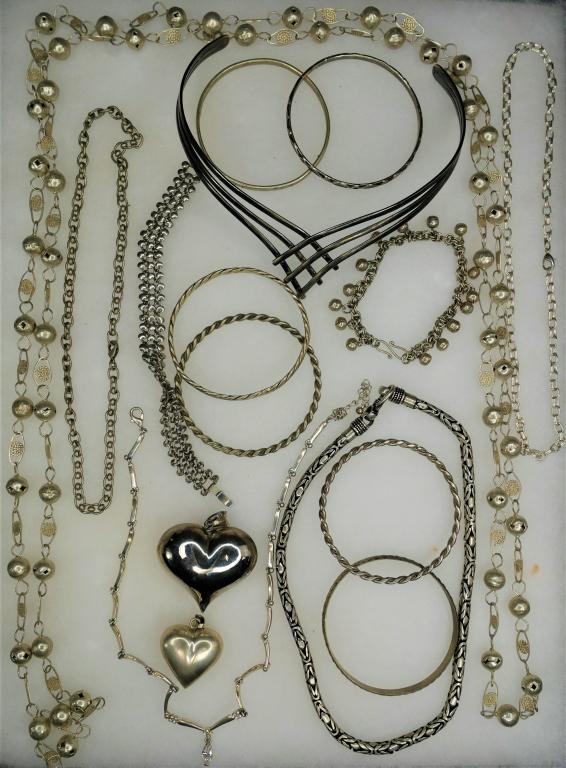 Vintage Silver Tone Jewelry Assortment: Group of Vintage Jewelry- Necklaces, Heart Pendants, Bracelets. All are in good condition.