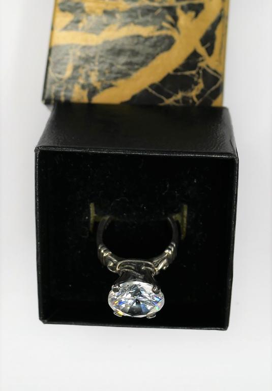 Sterling Silver Solitaire Ring w/ White Stone: Sterling Silver Solitaire Ring with White Cubic Zirconia Stone. Size- 5. Good Condition.