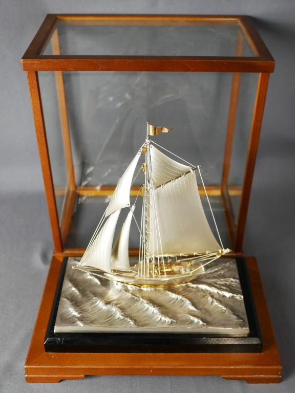 Silver Tone Sailing Ship Yacht Model in Display Ca: Silver Tone Sailing Ship Yacht Model in Display Case, Case is 9 1/2"x 6 1/2" x 11". Good Condition.