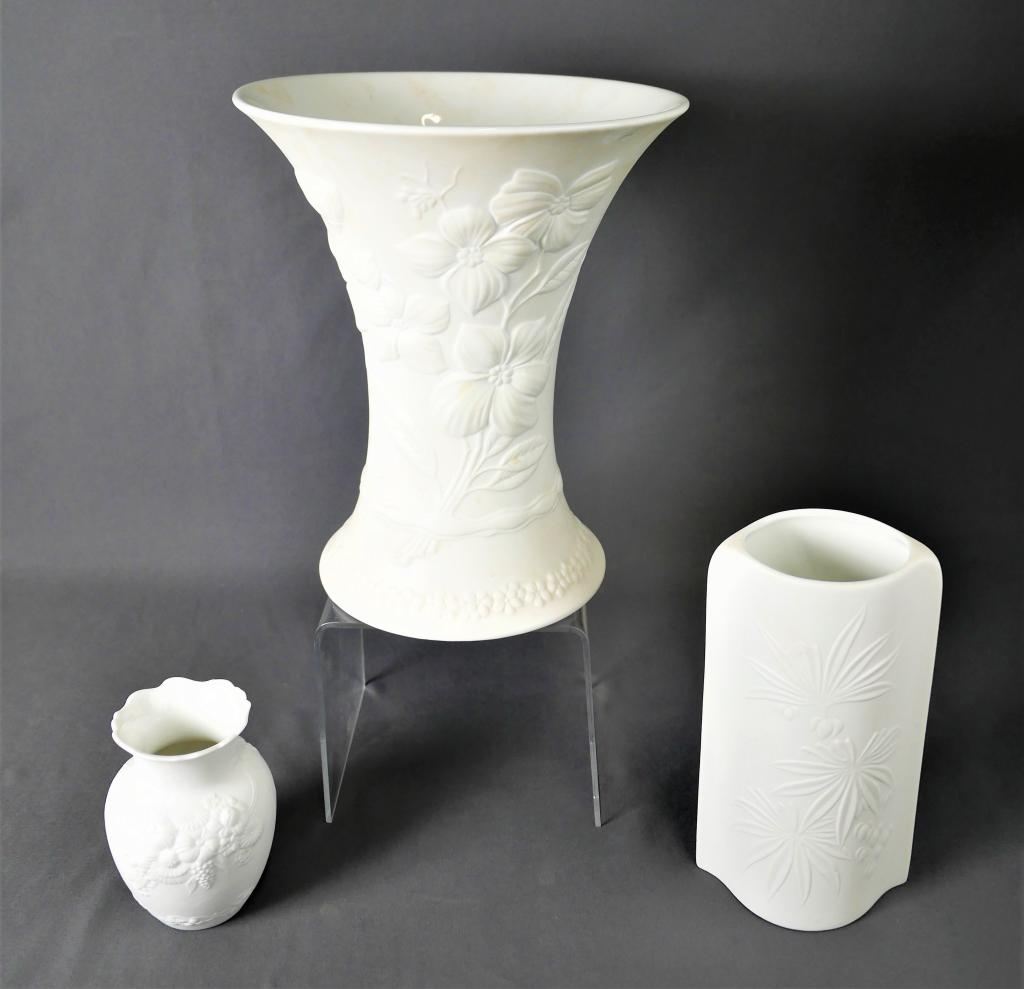 Kaiser & KPM German White Flower Porcelain Vases: Lot of 3 German Porcelain Vases from 1970's. Tall Kaiser 0352 Vase; Kaiser 7349 Vase and KPM 5100/19 Vase. Measure 10"-4 1/2" tall. All are in good condition.