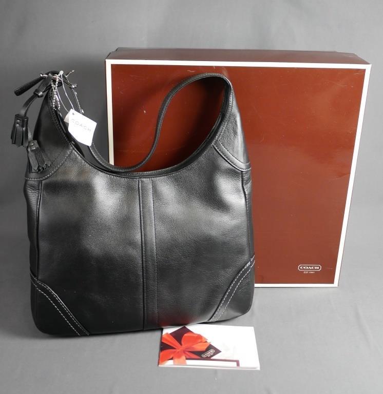Coach Designer Ladies Hamilton Leather Purse- New: Coach Designer Ladies Hamilton Leather Purse. No.G063-f10280. Measures approx. 12" x 10". New with tag in gift box. Esquis Auction does not have specialists on designer purses and handbags and we can