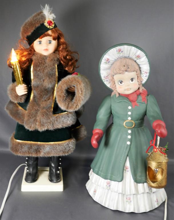 Christmas Holiday Decor- Two Carollers w/ Lights: Christmas Holiday Decor- Two Carollers with Lights. One is animated and otherone is ceramic with working lantern. Measure 24"-21" tall.