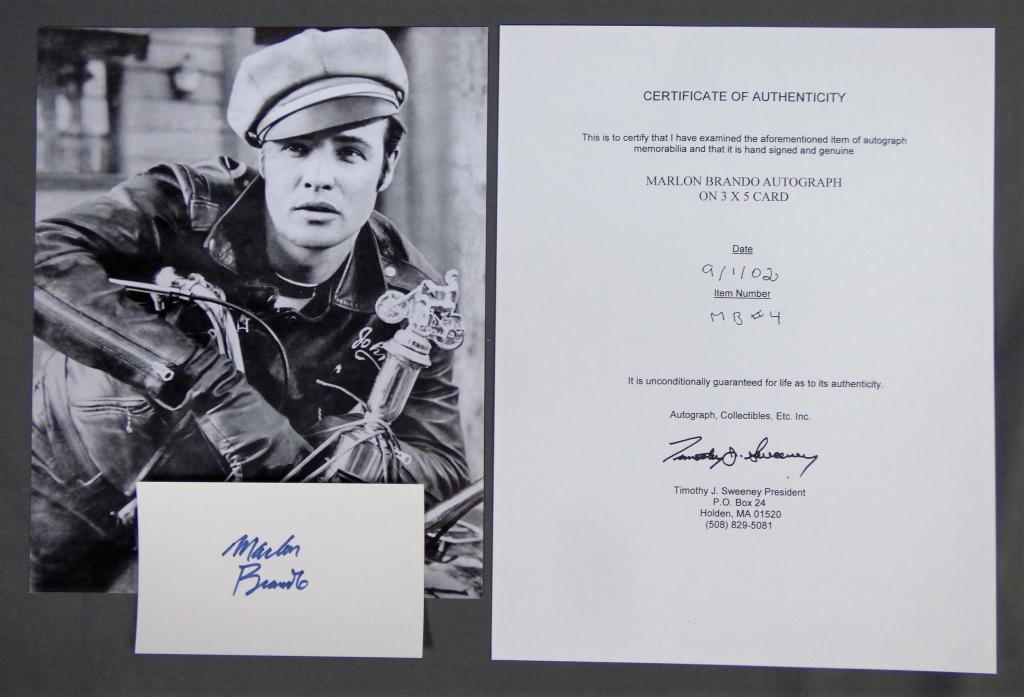 Marlon Brando Signature/ Autograph w/ Photograph: Marlon Brando Autograph on index card with 8" x 10" Photograph. Comes with Certificate of Authenticity. Condition: Good. We truly believe that this item is authentic, but Esquis Auctions does not have