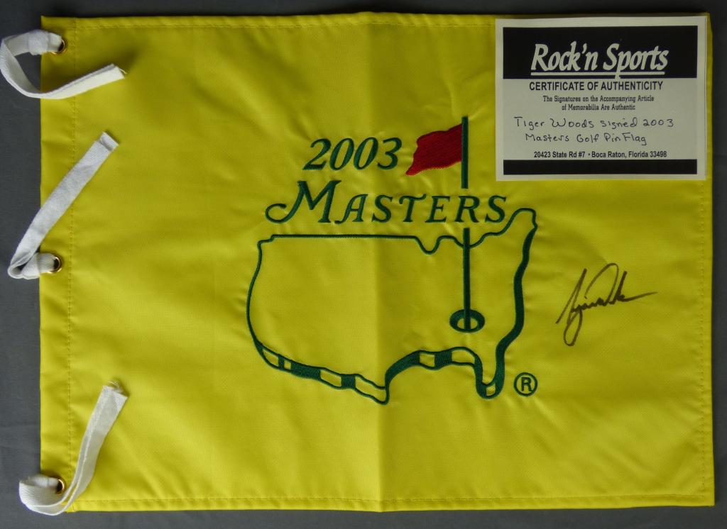 Tiger Woods Signed 2003 Masters Golf Pin Flag: Tiger Woods Signed/ Autographed 2003 Masters Golf Pin Flag. 18" x 13". Comes with Certificate of Authenticity. Condition: Good. We truly believe that this item is authentic, but Esquis Auctions does n