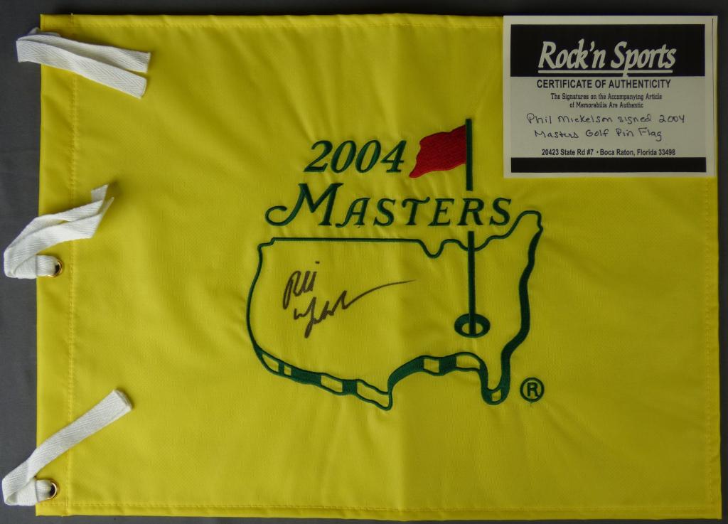 Phil Mickelson Signed 2004 Masters Golf Pin Flag: Phil Mickelson Signed/ Autographed 2004 Masters Golf Pin Flag- 18" x 13". Comes with Certificate of Authenticity. Condition: Good. We truly believe that this item is authentic, but Esquis Auctions doe