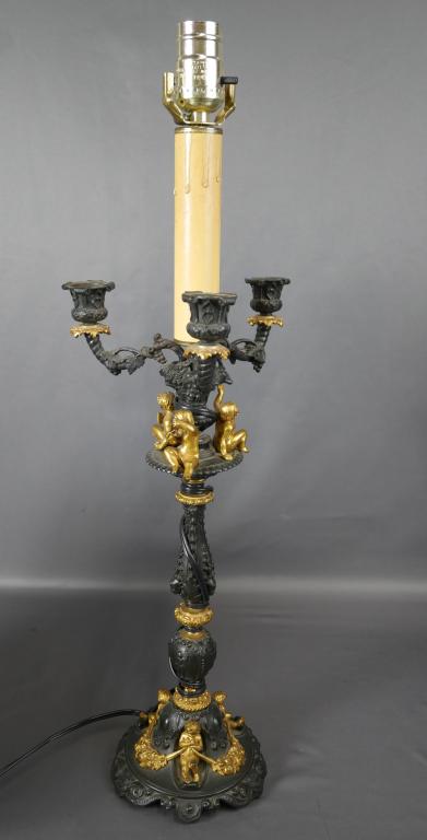 Vintage Table Lamp Candelabra w/ Cherubs: Highly Ornate 1940's European Table Lamp/ Candelabra with Cherubs and Pans. Measures 24" tall. Good overall condition, rewired some time ago.