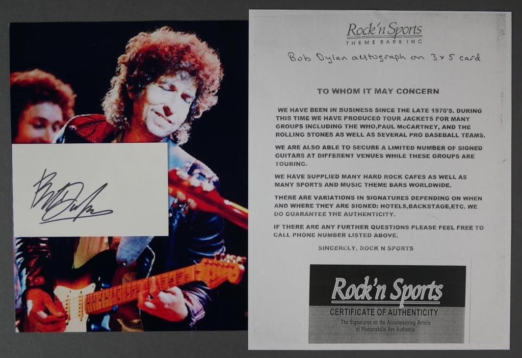 Bob Dylan Autograph/ Signature w/ COA: Bob Dylan Autograph/ Signature on 3" x 5" Index Card with 8" x 10" Photograph. Comes with Certificate of Authenticity. Condition: Good. We truly believe that this item is authentic, but Esquis Auction