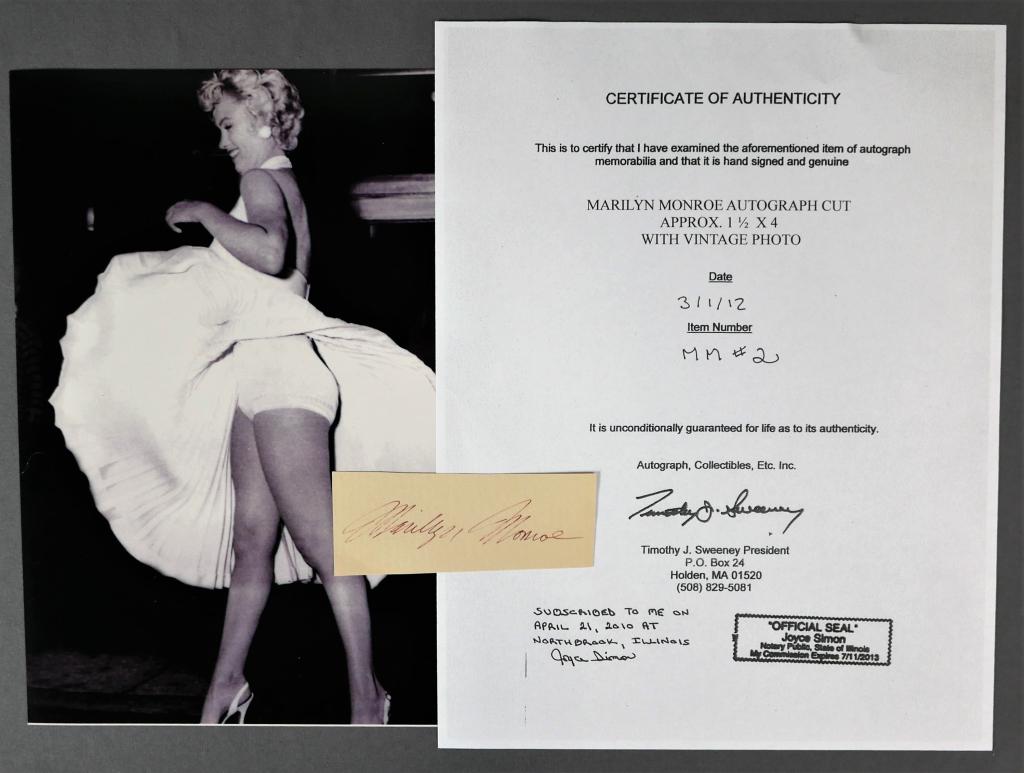 Marilyn Monroe Autograph/ Signature w/ Photo: Marilyn Monroe Autograph/ Signature Cut with 8" x 10" Photograph. Comes with Certificate of Authenticity. Condition: Good. We truly believe that this item is authentic, but Esquis Auctions does not ha