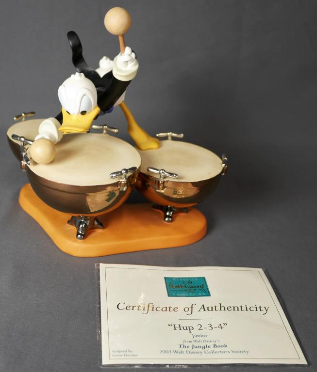 WDCC Disney Symphony Hour Donald's Drum Beat: WDCC Disney Classics "Symphony Hour "- Donald's Drum Beat. Measures 9" x 6" x 8". Good overall condition, no original box, comes with COA.
