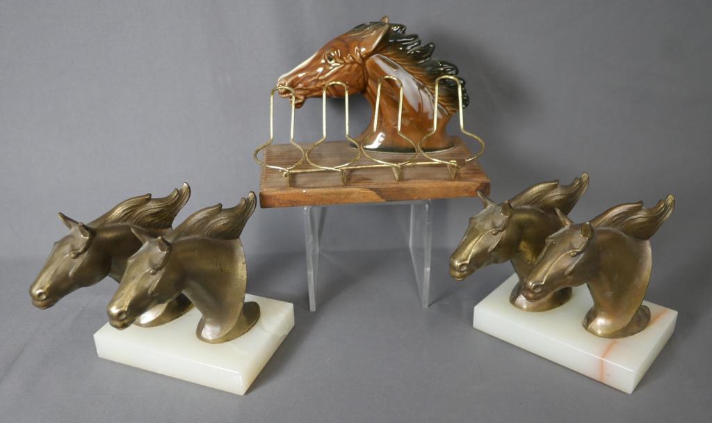 Brass Horse Bookends & Horse Pipe Holder: Pair of Brass Double Horse Head Bookends on onyx base and Ceramic Horse Smoking Pipe Holder. 7" x 4" x 5" and 5" x 5" x 5". All are in good condition.