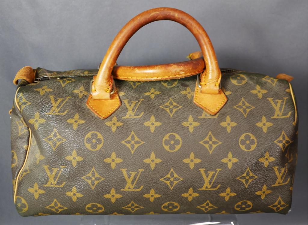 Louis Vuitton Satchel Handbag/ Purse/ Bag: Vintage Louis Vuitton Satchel Handbag/ Purse/ Bag. Shows wear, needs some alterations. Esquis Auction does not have specialists on designer purses and handbags and we can not guarantee authenticity of