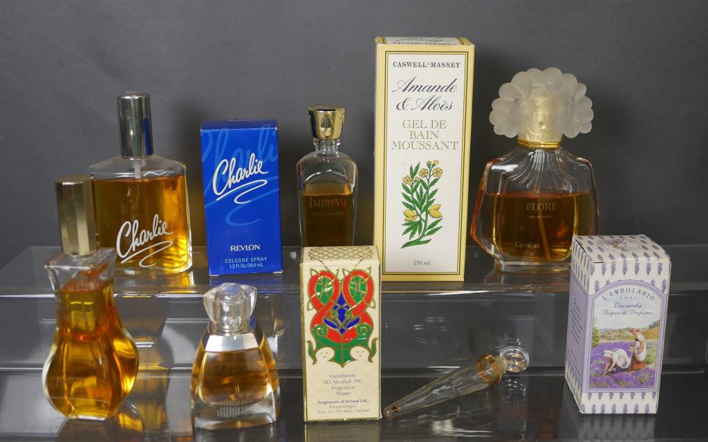 Lot of Ladies Perfumes- Coty, Flore, Vera Wong: Group of Ladies Perfumes including Coty, Flore, Wera Wong, Revlon, et... Mostly full/ near full, one glass bottle is empty.