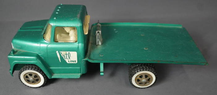 Vintage Ertl Truck Line Tilt Bed Toy Model: Vintage Ertl Truck Line Tilt Flat Bed Truck in Aqua Green Color with Driver. 1:16 Scale. Good overall condition, some age related wear.