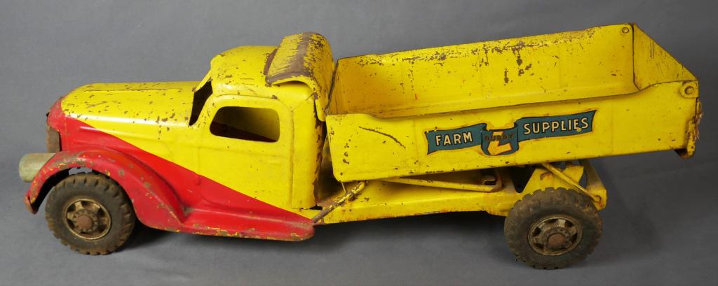 1940's Buddy L Farm Supplies Pressed Steal Truck: Vintaeg Buddy L "Farm Supplies" Pressed Steal Truck. 21"x 6 1/2" x 6". Age related wear.